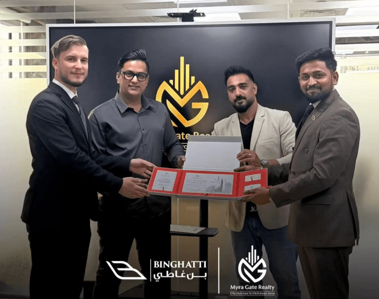 Myragate Realty team with Binghatti representatives holding project documents